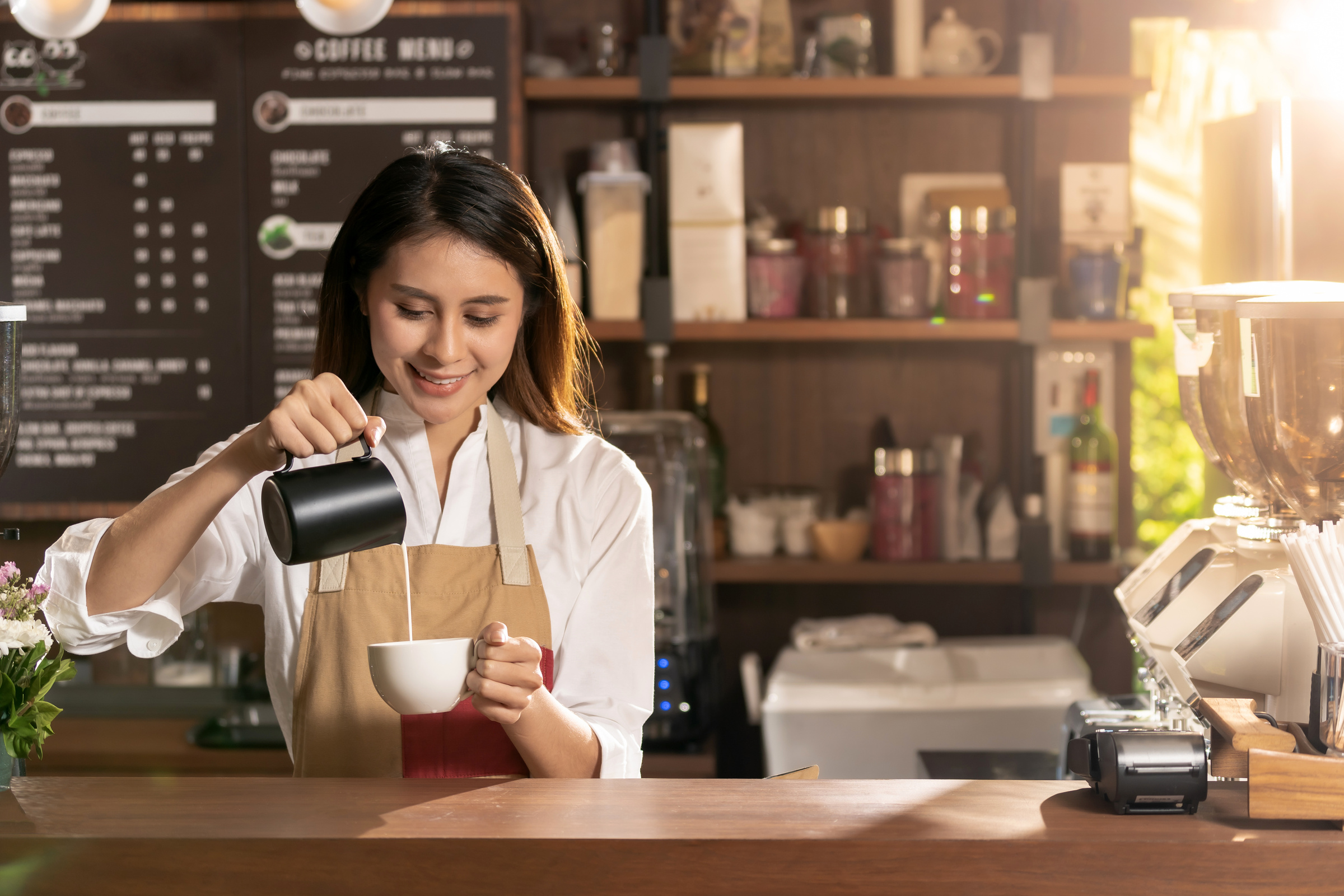 Female barista making coffee